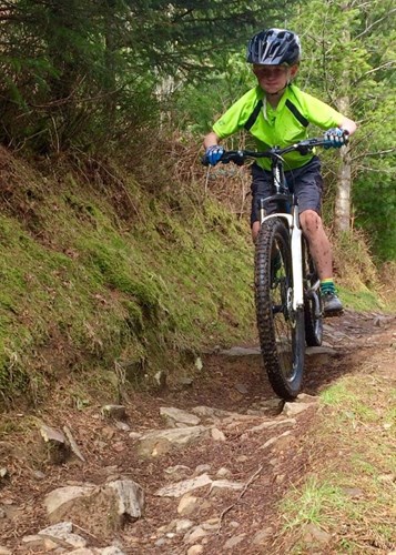 Boy riding on trail